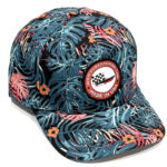 Baseball cap with blue tropical leaf print and a round patch that says Made in USA with a checkered-flag logo on the front panel